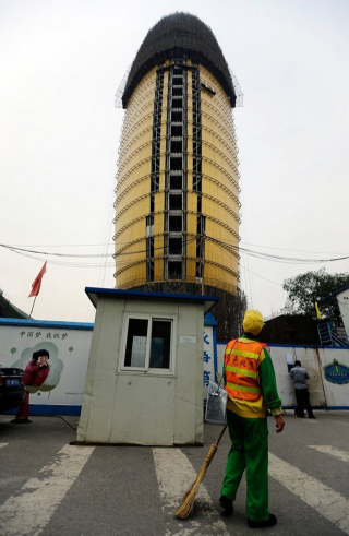Illustration for article titled Chinese Newspaper's HQ Now Looks Like a Golden Penis